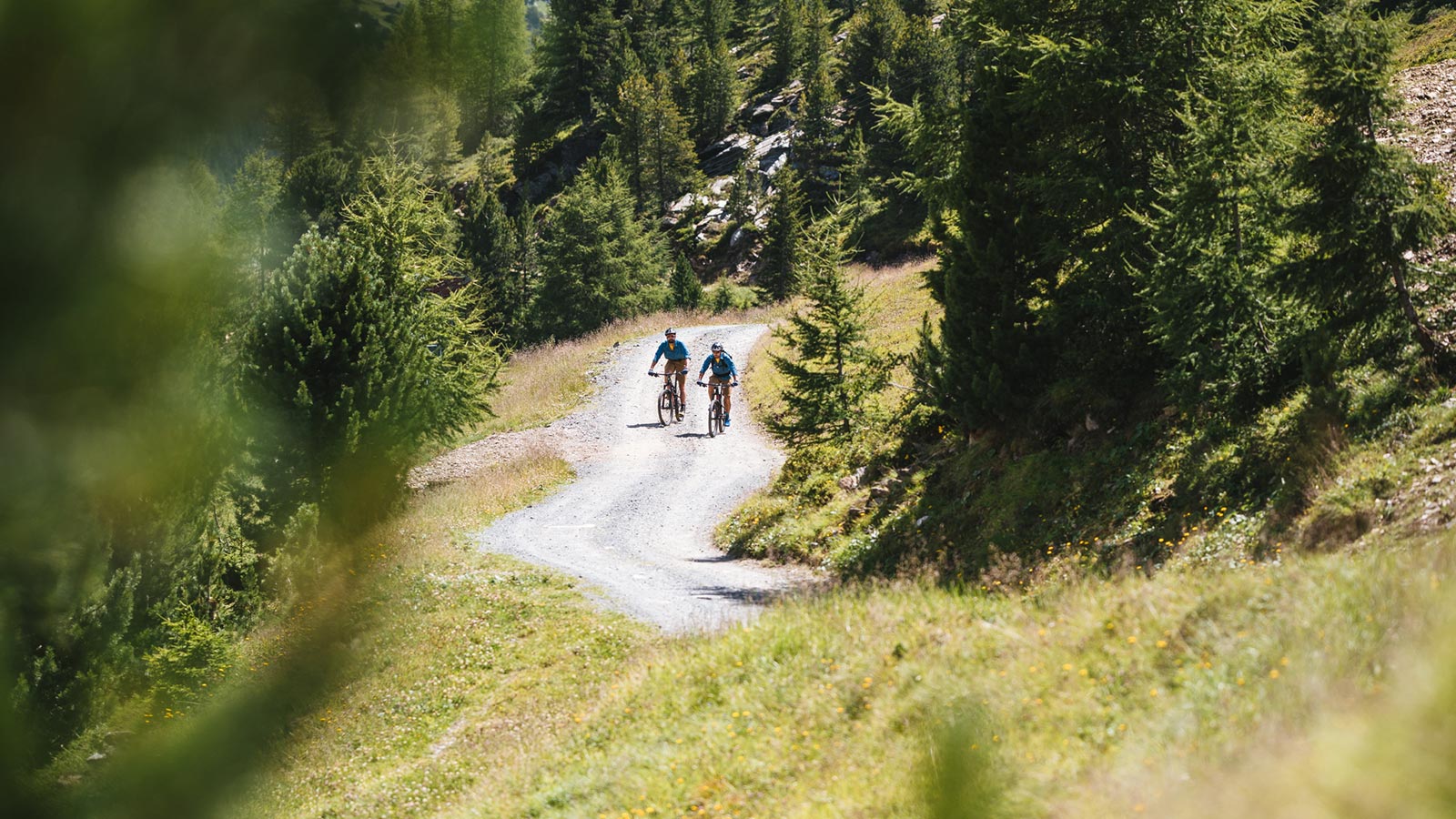 Two bikers on a summer hike around the Sunny Valley Mountain Lodge